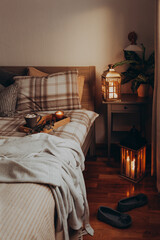 Wall Mural - cozy scandinavian bedroom interior in natural tones, blanket candles houseplants