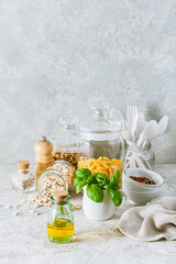 Wall Mural - kitchen utensils on modern simple counter, kitchenware jars with dry ingredients bowls