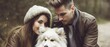 Young couple withe a white dog in the nature.