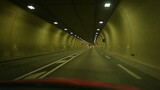 Fototapeta Tulipany - Car passenger POV inside tunnel in hectic speed. Vehicle journey commute perspective