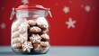  a glass jar filled with cookies covered in white icing and snowflakes on a red and white background with snowflaked snowflakes in the background.