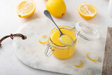 Fototapeta  - Freshly made lemon curd in a jar
