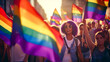 Woman holding rainbow flag in group of other people holding rainbow flags.