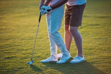 Wall Mural - Couple playing golf