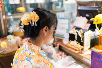 Sticker - Woman undergo the hair stylist and wear the kimono in the studio