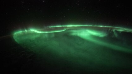Wall Mural - aurora and northern lights over planet earth seen from space. view from international space station.