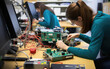 © piai - Students working in advanced lab with science equipment. Microchips design and electronics development.