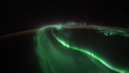 Wall Mural - northern lights over planet earth seen from space. view from international space station. public dom
