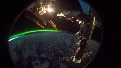 Wall Mural - flying over earth at night. northern lights aurora at night from above. view from international spac