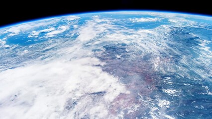 Wall Mural - beautiful clouds and atmosphere of planet earth from above. flying over planet earth. view from inte