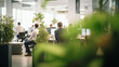 Business office in germany with blurred people casual wear, with blurred bokeh background. good atmosphere, many green plants,