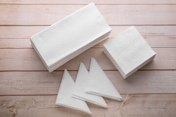 Wall Mural - Clean paper towels and tissues on light wooden table, flat lay