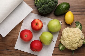 Wall Mural - Apples drying on paper towel, fruits and vegetables on wooden table, flat lay