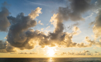 Wall Mural - abstract amazing scene of stuning colorful sunset or sunrise with clouds background in nature and tr