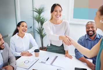 Wall Mural - Business people, handshake and finance meeting in team for promotion, onboarding or welcome to company. Asian woman, shaking hands or happy for congratulations, hiring or thank you with deal in group