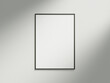 © CreatifyStudio - Minimal picture poster frame mockup on white wallpaper with sunlight