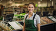 Smiling young woman cashier in uniform in a supermarket. Job invitation banner, vacant place of sales floor worker or seller in grocery store. 