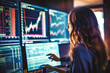 © VisualProduction - Beautiful female financial analyst examining stock display in her office, successful business woman analyzing data from computer screen