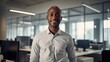 © Dangubic - Smiling African American Young Man in Modern Office