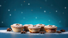 Delectable Festive Mince Pies Adorned With Star-shaped Pastry Tops And Sugar Dust, Set On A Vibrant Teal Background.