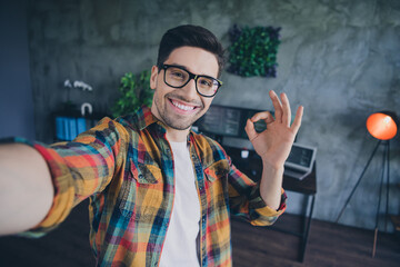 Canvas Print - Portrait of handsome positive guy toothy smile hand fingers demonstrate okey symbol workplace loft office indoors