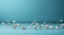  A Group Of White Stars Sitting Next To Each Other On A Blue Surface With One Star Falling Off Of The Left Side Of The Image To The Right Of The Other.