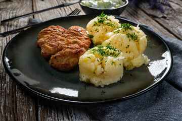 Poster - Pork chop served with mashed potatoes and cucumber salad.