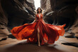 Beautiful Woman in red dress walking trough canyon