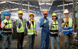 © offsuperphoto - group of workers or engineers raise hands and victory pose for success work and project in the factory