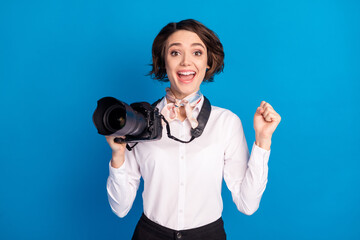 Sticker - Photo of delighted impressed lady open mouth fist up celebrate achieve isolated on blue color background