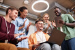 © AnnaStills - Group of business people making successful online project, they smiling and clapping hands