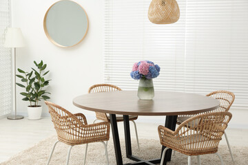 Wall Mural - Table, chairs and vase of hydrangea flowers in dining room. Stylish interior