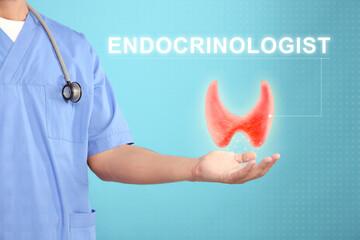 Sticker - Endocrinologist holding virtual thyroid gland on light blue background, closeup