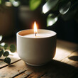 Photo of a white candle in a ceramic holder, lit and angled to create an artistic and serene scene. The candle is placed on a rustic wooden table, with a backdrop of blurred green plants.