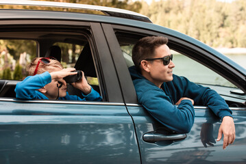 Wall Mural - Family roadtrip father and son in car exploring nature countryside. Family travel adventure roadtrip concept 