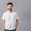 © Porscifant Art - White T-Shirt Mock Up Man with Black Hair and Beard Smiling, Hands in Pockets Gray Background