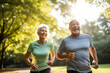 © Moritz - Elderly old couple jogging in a park: Celebrating health and fitness in later life