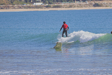 Watching a Longboard surfing contest in Rinon Cove, California