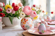 Spring  Ranunculus Blooms and Painted Easter Eggs on the table