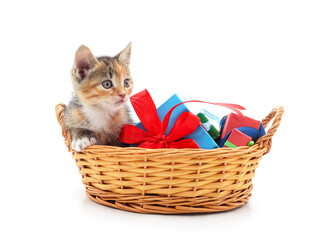 Canvas Print - Red kitten in a basket with gifts.