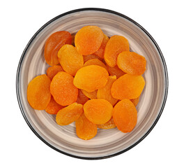 Wall Mural - Dry apricots in bowl isolated on white, top view
