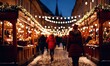 Girl walking in Christmas market decorated with holiday lights in the evening. Feeling happy in big city. Spending winter vacations in festive town. Back view. Winter holidays