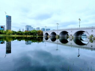 Stone bridge in a modern city in the daylight