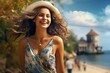 Portrait of the beautiful caucasian girl in hat with wind fluttering hair on summer beach close up. Health, relaxation, travel concept