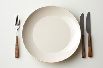 Wall Mural - A plain ceramic plate and cutlery set, awaiting custom designs for a unique dining experience. Generative Ai.