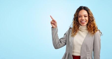 Wall Mural - Happy business woman, pointing and advertising in marketing on mockup against a blue studio background. Portrait of female person or employee smile showing advertisement, list or product information