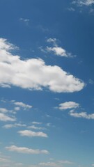 Wall Mural - White clouds and blue sky. No birds, no flicker. High quality 4k time lapse