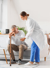 Poster - Nurse helping senior man to stand up at home