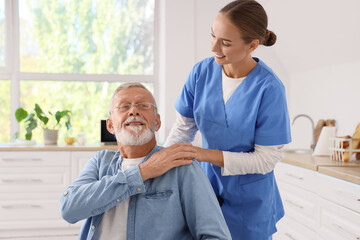 Sticker - Senior man in wheelchair with nurse at home