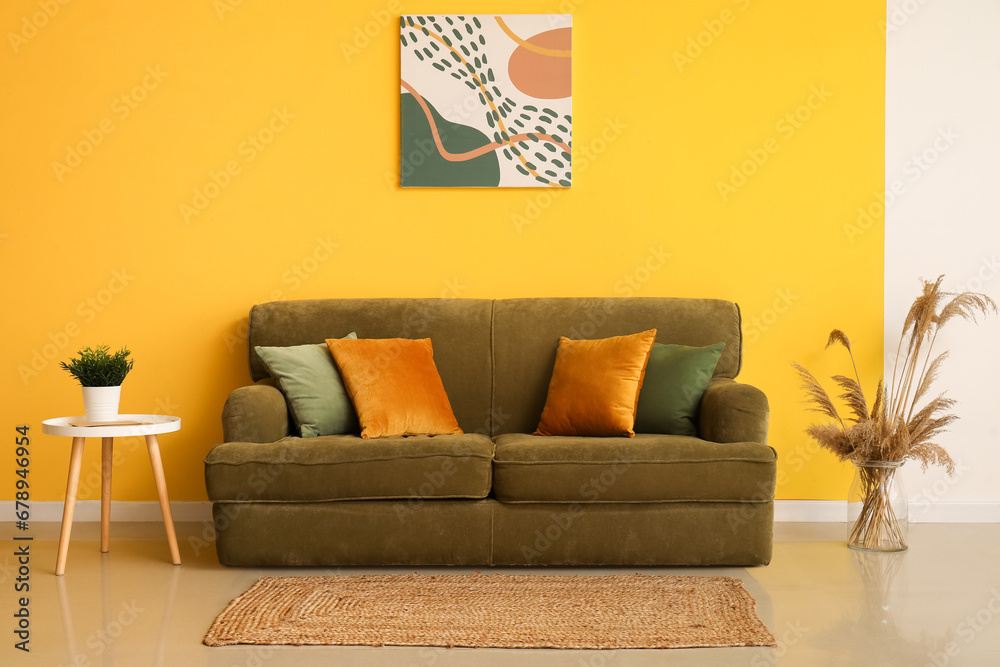 Interior of modern room with green sofa